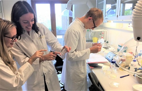 Team members doing lab work